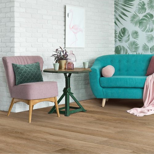 teal couch and pink chair on hardwood floors - keystone carpets inc in WA