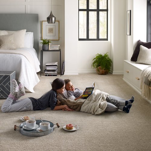 two kids laying on carpet reading a book - Keystone Carpets Inc in WA